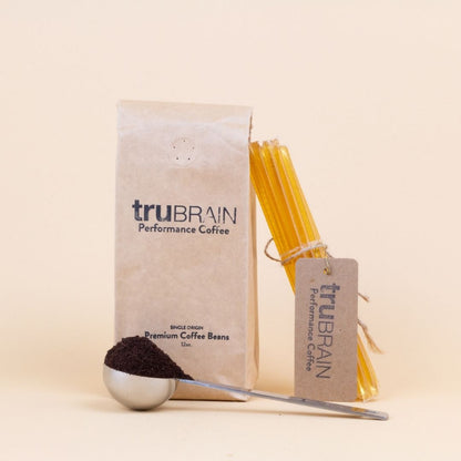 Closeup hero shot of TruBrain’s Coffee Kit, with Whole Bean TruBrain Coffee with no-taste Nootropic Topping of L-theaninne for a smooth, low acid coffee experience